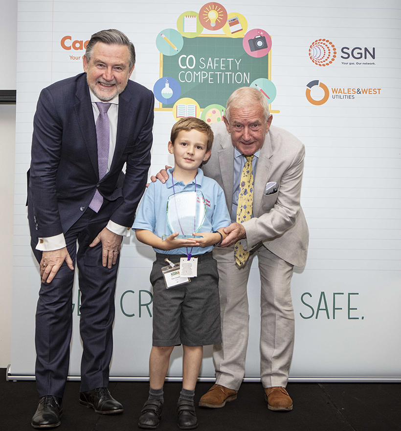 Winning artist Owen Campbell with his award and MPs Barry Gardiner (left) and Barry Sheerman (right).