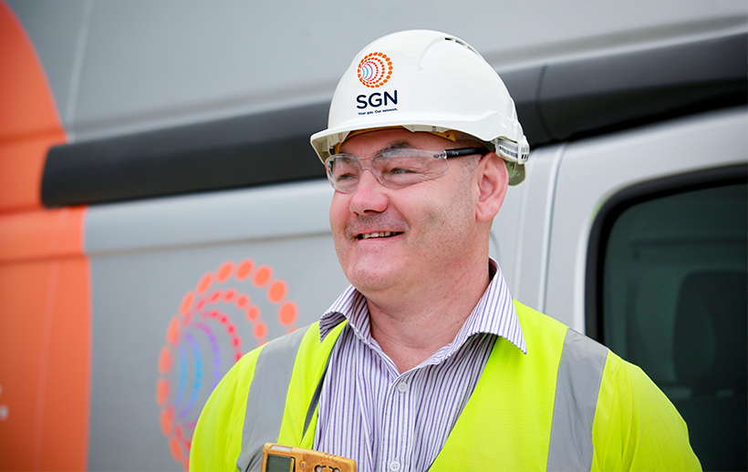 Our engineer standing in front of his SGN van