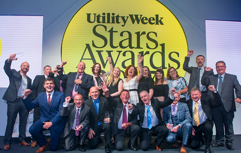 Our celebrates with cheers hands in the air at the Utility Star Awards