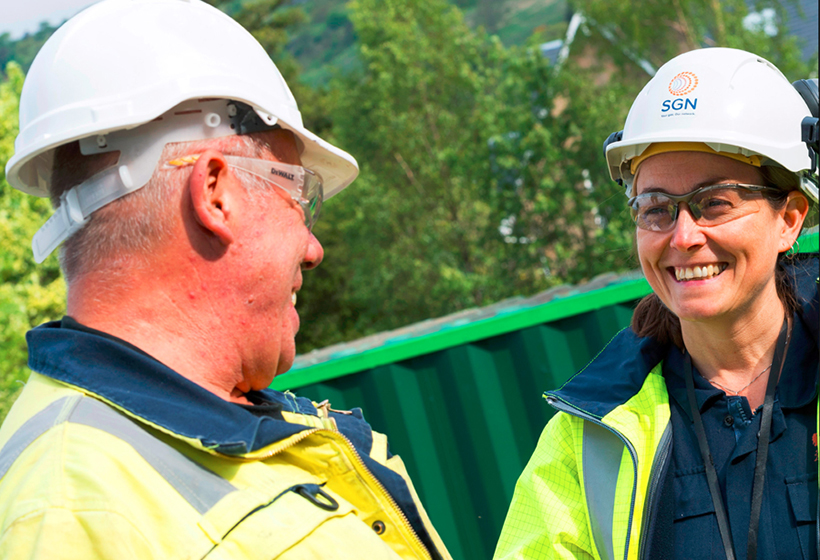 2019 gender pay gap report cover - a male and female engineer talking to one another