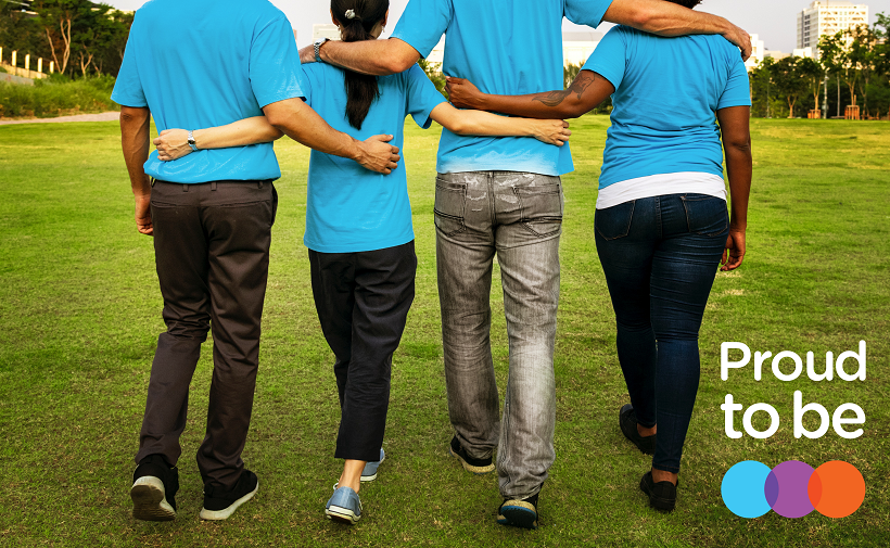 Group of people with arms around each other