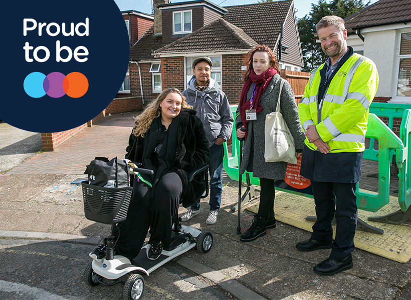 CEO John Morea with three people who have mobility issues.