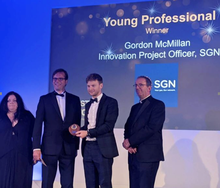 Gordon McMillan picking up an award on stage