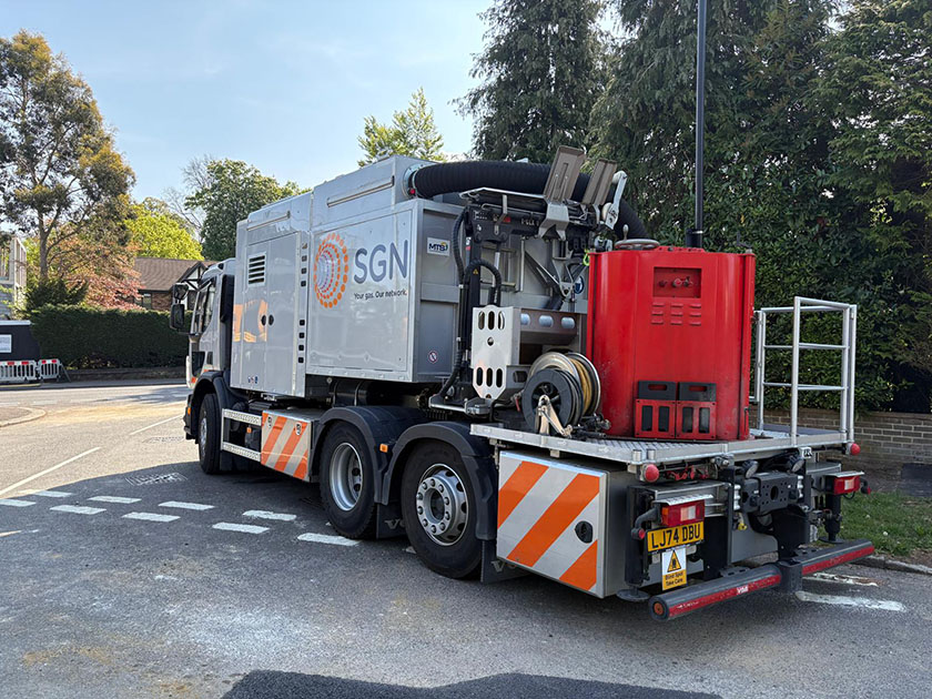 SGN's new Core & Vac Mk3 excavation and reinstatement vehicle parked on the side of a road near roadworks site