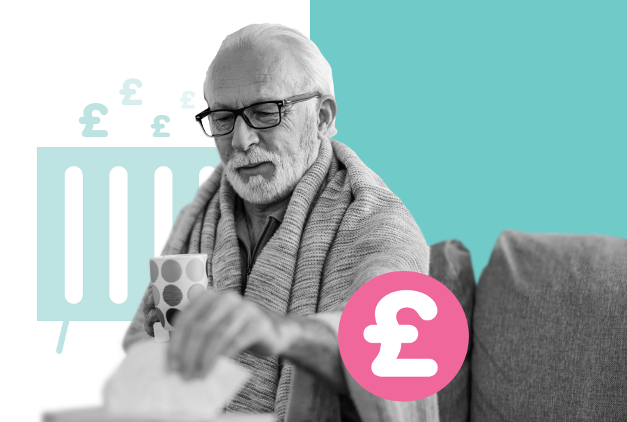 An older man is sitting on a chair with a hot drink in his hand, wrapped in a blanket