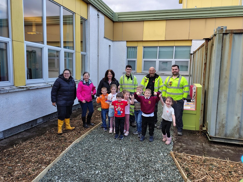 Pupils, teachers and SGN staff standing at the new outdoor space created for Stornoway Primary School