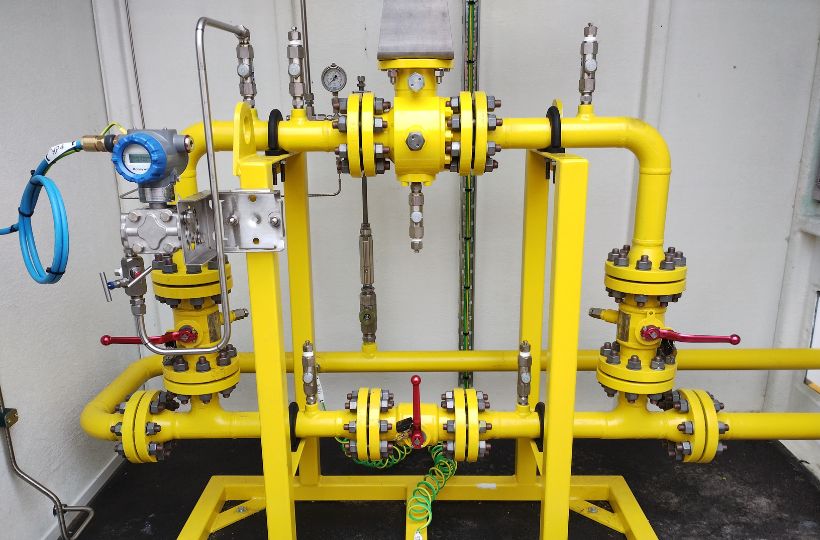 Image showing a complex set of yellow pipes and valves