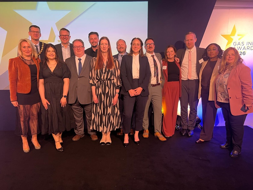 SGN employees standing in front of large display screens at the 2026 Gas Industry Awards after winning three awards