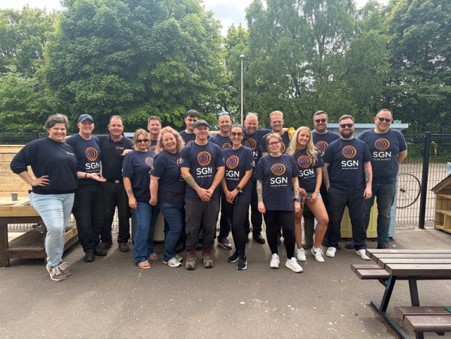 Team of volunteers stand at Tayview Primary School