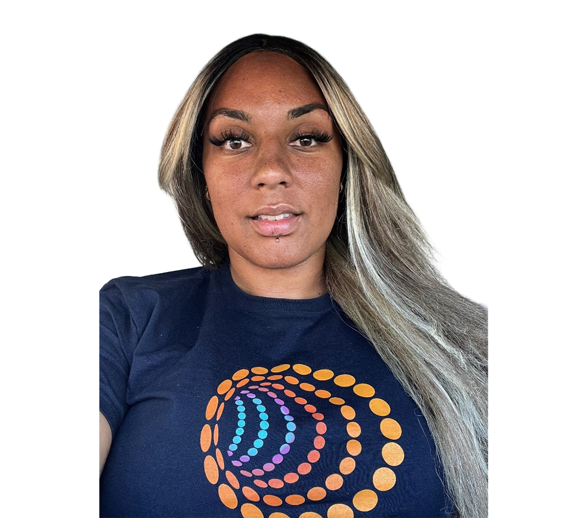 A selfie of a Black woman looking at the camera against a blank background