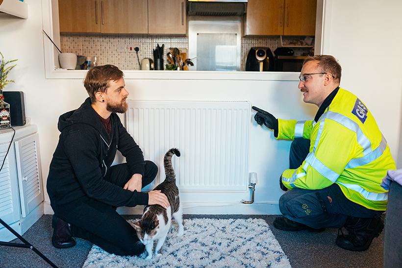 Engineer helping customer with home heating