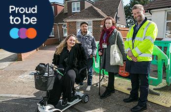 CEO John Morea with three people who have mobility issues.