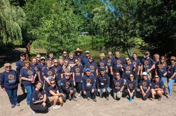 A group shot of colleagues from our HR and Services team at the Orpheus centre lake