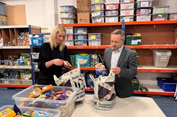 Linda Spence and Jonathan Brearley packing bags for families in need at the Trussell Trust Food Bank