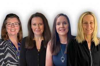 Four smiling women on a white background