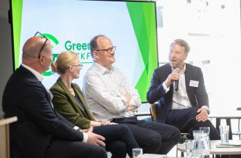 Four people at a panel during the launch of the Green Gas Taskforce. There is one woman with three men, including Marcus Hunt, our Business Development Director