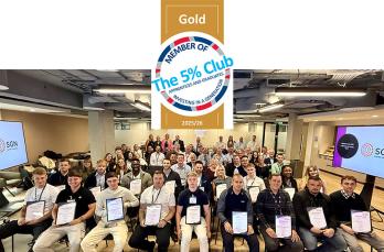 A group of men and women holding certificates