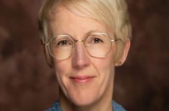 Head and shoulders image of Emily Smith as SGN's new General Counsel. She wears glasses and business attire.